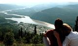 Couple looking out across Dawson City, Yukon